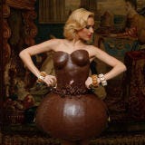 <b>Creator:</b> German bakery group <a href="http://www.bing.com/search?q=Lambertz&qs=n&sk=&sc=8-8&form=delish" target="_blank">Lambertz</a><br /><b>Delicious Details:</b> Have we died and gone to chocolate heaven? Made of 100% solid chocolate, this edible bustier bubble dress was carefully worn by German model <a href="http://www.bing.com/search?q=Alena+Gerber+&go=&qs=n&sk=&form=delish" target="_blank">Alena Gerber</a> for an annual show in <a href="http://www.bing.com/places/search?q=Munich%2c+Germany&upgid=22344&qpvt=Munich+&FORM=delish" target="_blank">Munich</a> in January 2010. <br /><br /><b>Bing:</b> <a href="http://www.bing.com/videos/search?q=Chocolate+Fashion&view=detail&mid=A23B9A17D8BFF05E86FEA23B9A17D8BFF05E86FE&first=0&FORM=delish" target="_blank">Watch a video of more chocolate fashion creations</a> <br /><b>Search:</b> <a href="http://gogonow.org/search/fast_search_recipes?current_page=1&search_term=chocolate%20martini" target="_blank">Find a recipe for a chocolate martini</a> <br /><br />Want more chocolate couture? Check out these photos from <a href="/cooking-shows/fashions-new-york-chocolate-show" target="_blank">The New York Chocolate Fashion Show</a>.