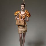 <b>Creator:</b> Photographer <a href="http://www.bing.com/search?q=Ted+Sabarese+&go=&qs=n&sk=&sc=8-13&form=delish" target="_blank">Ted Sabarese</a> with designer <a href="http://www.bing.com/search?q=Ami+Goodheart+designer&qs=n&sk=&form=delish" target="_blank">Ami Goodheart</a> of <a href="http://www.bing.com/search?q=SOTU+Productions&qs=n&sk=&sc=8-16&form=delish" target="_blank">SOTU Productions</a><br /><b>Delicious Details:</b> This bready dress is part of a series titled "Hunger Pains," in which models wore clothes depicting their personal cravings. Someone out there likes carbs. <br /><br /><b>Bing:</b> <a href="http://www.bing.com/images/search?q=SOTU+Productions+Hunger+Pains&go=&qs=ns&form=delish" target="_blank">See more photos of creations from "Hunger Pains"</a> <br /><b>Find:</b> <a href="http://gogonow.org/search/fast_search_recipes?search_term=stale+bread" target="_blank">Recipes using stale bread</a> <br /><br />Do you love carbs? Try this recipe: <a href="/recipefinder/challah-bread" target="_blank"><b>Challah Bread</b></a>