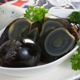 <p>Eggs in general symbolize fertility, but a Hundred-Year-Old-Egg or Century Egg is also considered a true delicacy. The appeal of this egg is its unusual appearance. Traditionally cured in a clay-ash mixture for weeks or even months, these eggs boast a dark creamy yolk and a very strong odor. </p><br />
<p><b>Instead, Try This Delicate Dish:</b> <a href="/recipefinder/asparagus-poached-eggs-citrus-ginger-vinaigrette-recipe-8796" target="_blank"><b>Asparagus with Poached Eggs and Citrus-Ginger Vinaigrette</b></a></p>