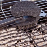 Always clean your grate immediately before and after cooking using a long-handled stiff wire brush. In a pinch, you can scour the grate with a ball of crumpled aluminum foil held in tongs.