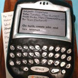 <b>The Bakers:</b> <a href="http://www.confetticakes.com/" target="_blank">Confetti Cakes, Ltd.</a>, New York, NY<br />
<b>The Challenge:</b> Stun the groom with a cake that will pull his eyes away from his BlackBerry.<br />
<b>Fun Fact:</b> This exact replica of a BlackBerry device even had a sugar-crafted scroll wheel on the side.<br />
