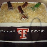 <b>The Bakers:</b> <a href="http://www.amazingkakes.com/" target="_blank">Amazing Kakes</a>, Austin, TX<br />
<b>The Challenge:</b> Combine two groom faves: beer and sports.<br />
<b>Fun Fact:</b> Those beer bottles aren't real, but they do contain some alcohol — they're made of a vodka, sugar, and Isomalt (a sugar substitute) mixture.<br />