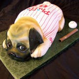 <b>The Bakers:</b> <a href="http://www.cakesbysuzy.com/" target="_blank">Cakes by Suzy</a>, Philadelphia, PA<br />
<b>The Challenge:</b> Get a pup ready for baseball season.<br />
<b>Fun Fact:</b> This Phillies-jersey-clad dog is a replica of the bride and groom's real furry best friend.<br />
