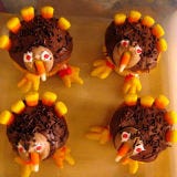 <b>Vital Components:</b> Candy corn plume and beak, plus <a href="/search/fast_search_recipes?search_term=cupcake" target="_blank">cupcake</a> body.