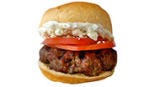 Divide 3/4 cup <a href="/recipefinder/tzatziki">tzatziki (cucumber yogurt dip)</a> + 1/2 cup crumbled feta cheese among 8 burgers. Top with thin slices tomato.