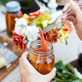 Pickling <p>Pickling isn't just for cucumbers! It adds a deliciously pungent, briny flavor to any vegetable you choose to use — though this method works especially well for naturally firm, crisp vegetables that will stand up to the pickling process, and won't turn to mush. A quick pickle (one that is not vacuum sealed in a canning jar) can last for up to 2 months in the refrigerator, and takes only minutes to make. To start, boil your pickling liquid — usually 1 or 2 parts vinegar to one part water, along with your favorite herbs and spices for flavoring. Boil mixture for about five minutes, then pour over the hot liquid over prepared vegetables. Allow pickles to cool before refrigerating. To process (in other words, to vacuum seal and preserve) your pickle, first put your vegetables into sterilized canning jars, leaving 1/4 inch of headspace. Pour the hot pickling liquid over them, then seal the jars. Place jars in a large pot of boiling water (lids should be covered by at least 1 inch of water), and boil for 10 to 15 minutes. Remove jar from water and fully cool on countertop, without moving, for 6 hours. Store in a cool, dark place for up to 1 year.</p><p><b>Recipe:</b> <a href="/recipefinder/pickled-heirloom-carrots-recipe-clv0711"><b>Pickled Heirloom Carrots</b></a></p>