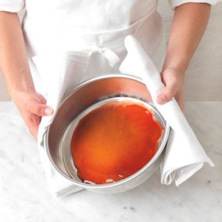 <p>When the caramel is a deep, rich brown, pour it into the base of a deep 8-inch cake pan.</p>