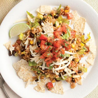 <p>Nobody will miss the meat in this colorful, zesty vegetarian taco salad. The rice and bean mixture can be made ahead and the salad quickly assembled at mealtime.<br /><br /> Recipe by Nancy Baggett for EatingWell.</p><p><b>Recipe:</b> <a href="/recipefinder/vegetarian-taco-salad-recipe-ew0510"><b>Vegetarian Taco Salad</b></a></p>