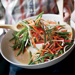 <p>Once you've mastered the dice, whether you know it or not, you've also mastered the julienne. Using your chef's knife, cut off the ends of the item you wish to julienne, and if necessary, as with peppers, remove any core, seeds, or inedible parts. Press the largest, flattest side against the cutting board (or create a flat side, if working with a round or lumpy food, like a carrot or potato, by cutting it in half lengthwise first). Cut lengthwise in 1/4-inch slices, creating long, rectangular, matchstick-like pieces.</p><p><b>Recipe:</b> <a href="/recipefinder/green-bean-slaw-recipe-fw0811"><b>Green Bean Slaw</b></a></p>
