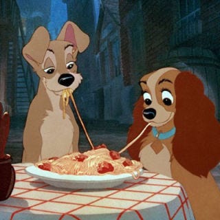 In one of the most classic movie images of all time, Lady and the Tramp share spaghetti — only to realize they're eating the same noodle. (Aww.)