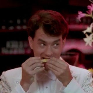 The 12-year-old Josh — who wakes up as a grown-up — goes to a fancy party and nibbles on baby corn. Then, of course, he quickly spits it out.