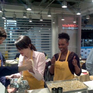 <p>Growing up in an Italian family in the food business, <a href="http://www.lacucinaatthemarket.com/" target="_blank">La Cucina at the Market</a> owner Anna Maria Florio always had a penchant for cooking. Five years ago while teaching Italian language at Temple University, she decided to combine her two passions: cooking and people. A space opened up in Philadelphia's Reading Market — a collection of 80 purveyors and food artisans — and she grabbed it. La Cucina's classes focus on everything from basic knife skills to the most popular class, Date Night ($175 for two) where couples prepare an elegant six-course meal. Recent recipes include: crostini with caramelized onions, fig jam, and goat cheese; sweet potato ravioli with brown butter; roasted pork tenderloin stuffed with Fontina, basil, and prosciutto; and mini ricotta canoli. Before class, students whet their appetite with a wine and cheese reception, then everyone gets down to business trying their hand at each dish. At the end of the night couples leave with print-outs of the recipes and full bellies.</p>