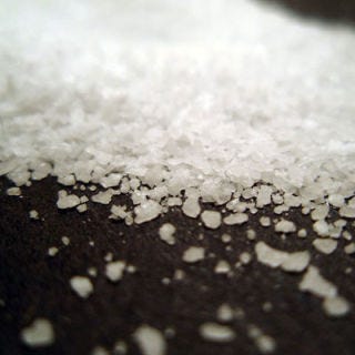Salt can be kept indefinitely so long as it's stored in a sealed container to keep out moisture.