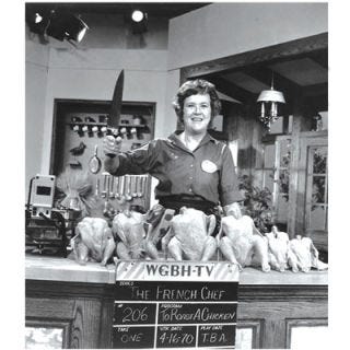 1962: <i>The French Chef</i> Debuted <p>The success of the book lead to Julia's first television appearance on WGBH's program, "I've Been Reading." She arrived with her copper bowl, eggs, mushrooms, whisk, and a hot plate and whipped up basic omelet for the TV audience. After its airing, the station received dozens of letters from viewers begging for more of her cooking instruction. Julia shot a few pilots focused on three classic French recipes: omelet, Coq au Vin, and souffle. <i>The French Chef</i> premiered on February 11, 1963, and over the next decade Julia Child became the country's most loved cooking instructor. She always let viewers know that if they made a mistake, "your guests will never know." She ended each show raising her wine glass while proclaiming, "This is Julia Child, bon appetit!"</p>