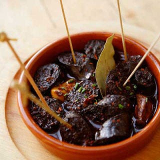 <p>Jim German and his wife, Claire Johnston, make wonderfully simple snacks to accompany his cocktails. A favorite at their restaurant, <a href="http://www.jimgermanbar.com/" target="_blank">Jimgermanbar</a>, is this smoky Spanish sausage with garlic, cooked gently in red wine until it's plump and juicy.</p><p><b>Recipe:</b> <a href="/recipefinder/chorizo-poached-in-red-wine-recipe-fw0410" target="_blank"><b>Chorizo Poached in Red Wine</b></a></p>