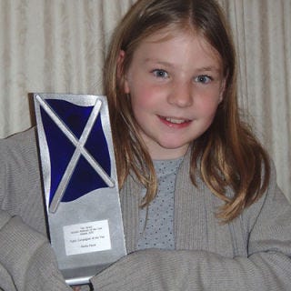 Hair, Hairstyle, Eye, Eyebrow, Iris, Blond, Brown hair, Curtain, Sweater, Award ceremony, 