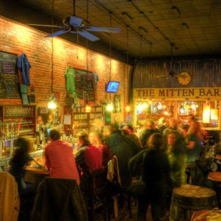 The Mitten Bar, Ludington, MI <p>Owner Megan Payment named The Mitten after the shape of her home state and curates a Michigan-only menu, with beers like Founder's blood-red Blushing Monk, fermented with raspberries. Not only does the small-town bar court regulars with local bands and beers, but it also draws customers across state lines with hard-to-find kegs like Bell's Brewery's Hopslam Ale, made with pungent, aromatic hops and a dollop of honey. <a href="http://mittenbar.com"target="_blank"><i>mittenbar.com</i></a></p>
<br />
<p>Photo: Dustin Kunkel</p>