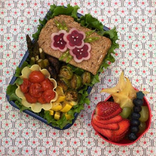 Roasted veggies are a healthy counterpart to a whole-wheat sandwich decorated with lovely beet "flowers."