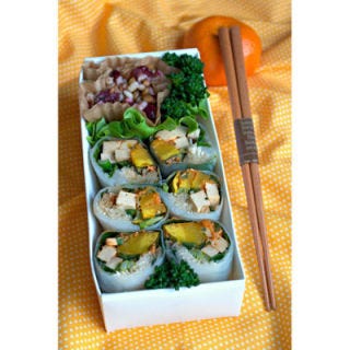 Spring rolls cozy up to a wheat berry salad in a filling boxed lunch.