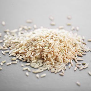 Brown rice retains the high-fiber, nutritious bran coating that's removed from white rice when hulled. It takes longer to cook than white rice and has a chewier texture. Once cooked, the long grains stay separate, while the short grains are soft and stickier.