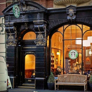 Ritziest Starbucks Entrance: London, England <p>In true British fashion, this London Starbucks, located on 99 St. Martins Lane in Covent Garden, is quite posh. Outside you will encounter an ornate façade with gorgeous gold detailing. Inside the store boasts reproductions of programs from the London Coliseum as well as other historic images. While we can't say this is Pippa Middleton's favorite Starbucks location, it is well known that the Duchess of Cambridge's sister has often stopped by the coffeehouse for one of their signature espresso drinks.</p><p><i><a href="http://www.starbucks.co.uk/" target="_blank">Starbucks</a>, 99 St. Martins Lane, London
GB-ENG</i></p>