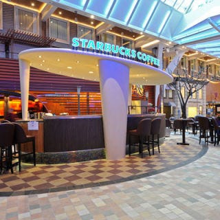 On Board Starbucks: Royal Caribbean <p>Are you concerned that you won't be able to get your daily Starbucks fix while you're on a cruise? Don't fret. Starbucks and Royal Caribbean teamed up in 2010 to introduce the world's first Starbucks at sea. The store is located on the Allure of the Seas, the world's largest cruiseship. While sailing the Caribbean, signature espresso drinks and snacks are available for serving to the 5,400 vacationers. Let's just hope they don't all want their cup 'o Joe at the same time!</p><br /><p><i><a href="http://www.royalcaribbean.com/findacruise/experience/html.do?exCode=995" target="_blank">Royal Caribbean</a>, Starbucks aboard the Allure of the Seas </p>