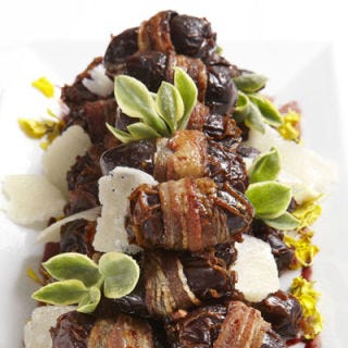 Bacon-wrapped dates — like the ones shown here with a reduction and shavings of semifirm cheese — will be another easy-to-eat passed appetizer.