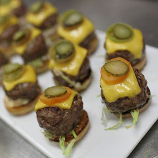 Who can resist a slider? We're willing to bet these mini kobe burgers — topped with aged cheddar, tomatoes, pickles, lettuce, and rémoulade — are going to be a Sunday night hit.

