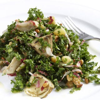 Even Wolfgang Puck is getting in on the trend that is kale. A vegan kale salad, tossed with grilled artichokes and a lemon vinaigrette, is one of the small cold plates on the menu.
