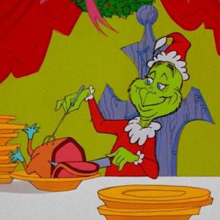 In this touching ending, the Whos seat the Grinch at the middle of their Christmas table after he brings back all the presents and "food for the feast." Most importantly, they give him one of the biggest honors, as the narrator explains: "He himself, the Grinch, carved the roast beast."