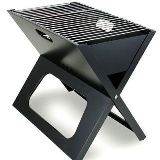 We'll be toting this <a href="http://www.amazon.com/gp/product/B001OC5PYY" target="_blank">Fire Sense Notebook Charcoal Grill</a> ($40) beachside for our next cookout. 

