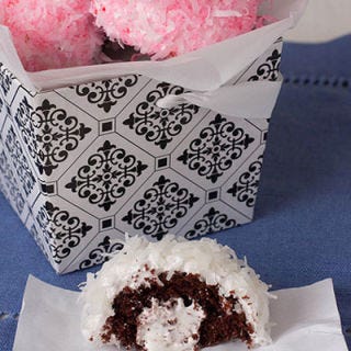<p>While they come in different colors at different times of the year (e.g., neon green for Halloween Glo Balls), Hostess Sno Balls are traditionally pink. <a href="http://kokocooks.com/2012/02/homemade-sno-balls/" target="_blank">This recipe</a> captures everything from the cream filling to the marshmallow coating to the delicate pink coconut flakes.</p>