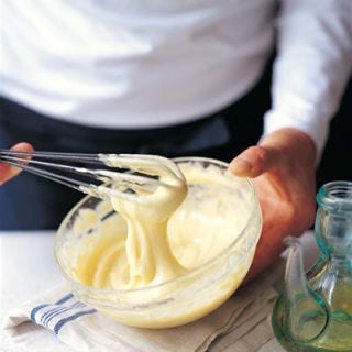 <p>Freshly made mayo is a real treat, especially if you're using it as the base of a homemade aioli or dipping sauce. But what do when it breaks? The key to making good mayo is proper emulsification — after all the other ingredients are whisked together, make sure to add the oil in a very slow, steady stream, whisking vigorously the whole time. If your mayo breaks, fix it by making a double batch — this may sound counter-intuitive, but trust us! In a separate bowl, begin again, adding the oil very slowly to the other items in the bowl and making sure to whisk each drop in thoroughly before adding more. Once you've started to get a good emulsified mixture going, whisk the broken sauce, little bit by little bit, into the better batch, just as you would usually add the oil. The emulsified mayonnaise will help bring the broken stuff together, and you'll have a bigger batch of perfect mayo.</p>
<p><b>Recipe: <a href="http://gogonow.org/recipefinder/mayonnaise-recipe%22 target="_blank">Basic Mayonnaise</a></b> (plus variations)</p>
