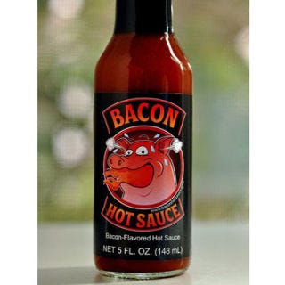 <p>It seems that bacon is appearing in everything these days, from candy and desserts to beverages like coffee and beer. And like bacon, hot sauce seems to make everything taste a little better. So why not combine the two in a bacon-flavored hot sauce? That was the revelation had by the three creators behind Bacon Hot Sauce one Sunday morning, anyway, and since then, the product's fan base has been steadily growing. Try it in your favorite meaty foods, like burgers, in a bloody mary, or, of course, on top of any breakfast dish.</p>
<p><a href="http://www.baconhotsauce.com/" target="_blank">baconhotsauce.com</a></p>