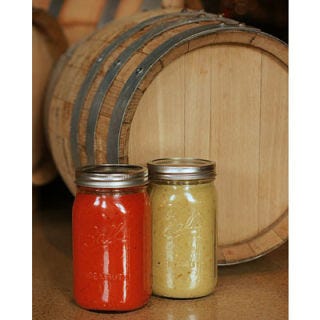 <p>At Vesta Dipping Grill in Denver, CO, Executive Chef Brandon Foster and Sous Chef Steven Cox are whipping up something pretty spectacular — their very own house-made hot sauces. And not only are these sauces made from scratch on site, they're also both aged for a minimum of 4 to 6 weeks in whiskey-rinsed (for the red sauce) or tequila-rinsed (for the green sauce) barrels, giving them a robust and truly unique flavor. The red sauce is made from Red Fresno chilies as well as super hot habanero peppers, and vinegar, garlic, and other seasonings, while the green sauce is made primarily from Serrano and jalapeño peppers. Both sauces can be purchased at the restaurant for heat-loving patrons to take home.</p>
<p><a href="http://www.vestagrill.com/" target="_blank">vestagrill.com</a></p>