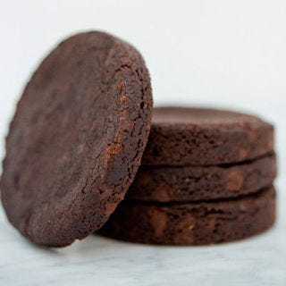 <p>Beloved cookbook author, blogger and baking authority, Dorie Greenspan, goes brick-and-mortar at a tiny storefront in the Essex Street Market, where she sells her masterful double chocolate World Peace Cookies: a base of dense chocolate sablé dough (a French-style shortbread) made with local butter, studded with hand-chopped bittersweet Valhrona chunks and a hefty measure of fleur de sel. Greenspan's recipe, which was given to her by renowned Paris pâtissier Pierre Hermé, calls for nearly equal measures of chocolate and flour, making for an ultrarich cookie that Greenspan describes as "very seductive," with the power to engender happiness and world peace in each bite.</p><p><a href="http://www.beurreandsel.com" target="_blank"><i>beurreandsel.com</i></a></p>