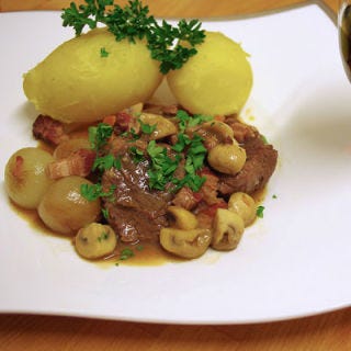 A slow-braised beef recipe originally considered a peasant's dish in its native France, beef bourguignon became popular among the American set thanks to Julia Child's Mastering the Art of French Cooking. The characters of Mad Men undoubtedly loved it for its liberal use of red wine!