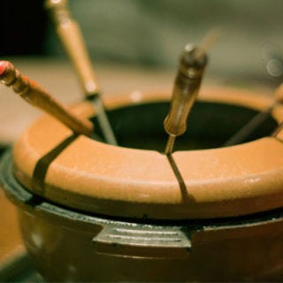 The fondue craze hit New York not long before Mad Men takes place. In the 1950s, Swiss restauranteur Konrad Egli introduced cheese fondue as well as fondue bourguignonne in which meat is cooked by dipping it in hot oil.