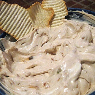A fast and easy version of French onion dip was made possible by the Lipton soup company, which created an onion soup mix that easily blended with sour cream.