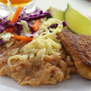 <p>Kids love this combination of refried white beans and chicken tenders. If you're concerned about making it too spicy, omit the jalapeño. Serve with extra reduced-fat cheese to sprinkle on top.</p><p><b>Recipe: </b><a href="/recipefinder/golden-chicken-spicy-refried-beans-recipe-5506" target="_blank"><b>Golden Chicken with Spicy Refried Beans</b></a></p>