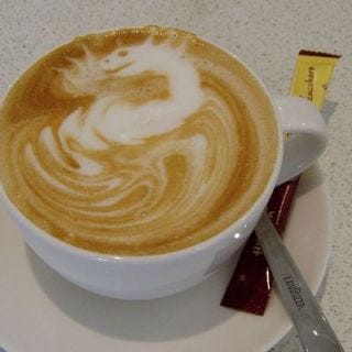 <p>Starting out from a simple pour, this fire-breathing dragon emerged. Stirring in that packet of sugar would be such a shame.</p>