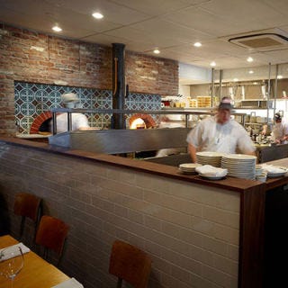 Franny’s; Brooklyn, NY Since relocating to a larger space down the street from its original home, this chef-adored, locally driven pizzeria has room for two wood-burning ovens, both built by Valoriani — a family-run Florentine company in business since 1890. Each oven is covered with beautiful tiles that Franny's owners Francine Stephens and Andrew Feinberg sourced from Mexico. Must try: Fresh clam pizza with chiles and parsley.
<br /><br />
<a href="http://frannysbrooklyn.com/" target="_blank">frannysbrooklyn.com</a>
