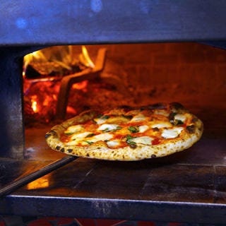 Tony’s Pizza Napoletana; San Francisco The 11-time World Pizza Champion Tony Gemignani uses eight ovens, each calibrated to cook a different pizza style. Gemignani's arsenal includes an electric oven that reaches 700 degrees for long, thin Roman-style pizza; a wood-fired brick oven set to 900 degrees for puffy, crispy-crusted Neapolitan pizzas; and a coal-fire oven set to a scorching 1,000 degrees for charred thin-crust pizza in the old-school New York-style. Must try: Gemignani's perfect Margherita with fresh cow-milk mozzarella, which took first prize at the World Pizza Cup in Naples.
<br /><br />
<a href="tonyspizzanapoletana.com" target="_blank">tonyspizzanapoletana.com</a>