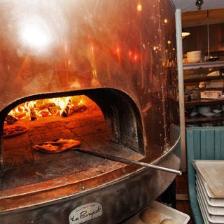 Rizzuto’s; Westport, CT His quest for a versatile oven led owner Bill Rizzuto to outfit his Westport location with a shimmering, copper-covered Le Panyol that he calls "Angelina." He loves it for its ability to withstand high heats — great for pizza — and for its heat retention, which is perfect for baking bread the morning after a night of pizza making. Underneath the copper, the oven is made from white clay mined from mountains in the south of France. Must try: "Grown-Up" Pepperoni Pie, topped with hot soppressata, caramelized onions, garlic, tomato sauce, extra-virgin olive oil and Parmigiano-Reggiano.
<br /><br />
<a href="http://www.rizzutos.com/" target="_blank">rizzutos.com</a>