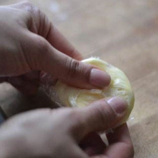 For the soft butter, wrap it in plastic wrap and gently soften it by warming it with your fingers. When added to the dough, it helps with the elasticity and texture.