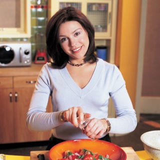 2001: EVOO Enters the Lexicon <p>Without Rachael Ray, we'd all still be wasting our breath uttering the proper name for "EVOO." Clever abbreviations weren't Ray's only skill. She brought the same time-saving aproach to her "30 Minute Meals," highlighting clever tips to create recipes that had to be "Yum-O"!</p>
