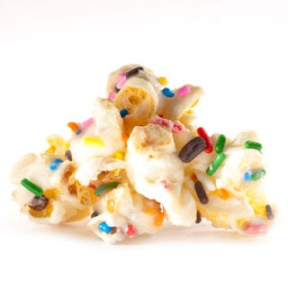 <p>Revel in nostalgia and enjoy the decadent taste of birthday cake all year long. This popcorn is coated in luscious white chocolate that has been infused with the flavor of cake batter. Then each crunchy cluster is rolled in colorful sprinkles for a festive finishing touch.</p>
<p><a href="http://www.kingofpop.com/" target="_blank">kingofpop.com</a></p>