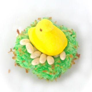 <p><em>To make: </em><a href="http://www.goodhousekeeping.com/recipefinder/coconut-macaroons-recipe-ghk1210" target="_blank">Follow our recipe</a> for easy coconut macaroons, adding a few drops green food coloring in step 2. Form nest shapes on a parchment paper lined baking sheet and bake as recipe direct. Fill with jelly beans and marshmallow chicks.</p>