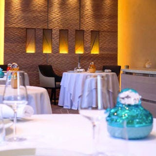 This three-Michelin-star <a href="http://blog.restaurantcrissier.com/" target="_blank">restaurant</a> is run by husband-and-wife team Benoît and Brigitte Violier and has a rich history of showcasing legendary chefs in the region for more than 40 years. Some signature dishes on menus past have included "Scarlet" tomato, pulp, and pip consommé with Imperial Ossetra caviar, and "Salers" beef grilled with wild pepper, cristallines de charlotte and young fresh salad leaves. The chef’s tasting experience will cost roughly $318 per person but there are also less expensive menu options available.