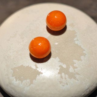 <p>Featuring Chef Rasmus Kofoed, Geranium has wracked up its fair share of culinary awards. They offer a tasting menu of 18 courses, which includes this delight. These crunchy spheres, made of carrot and jellified sea buckthorn, are the teasing start your tastebuds' journey.</p>
<p><strong>Geranium:</strong> Per Henrik Lings Allé 4, 2100 Copenhagen, Denmark; +45 69 96 00 20; <a href="http://geranium.dk/#/en/restaurant/welcome/" target="_blank">geranium.dk</a></p>